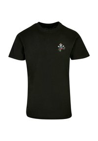 Black cotton t-shirt with a round neckline and short sleeves. Features a small colorful graphic on the chest depicting a character.