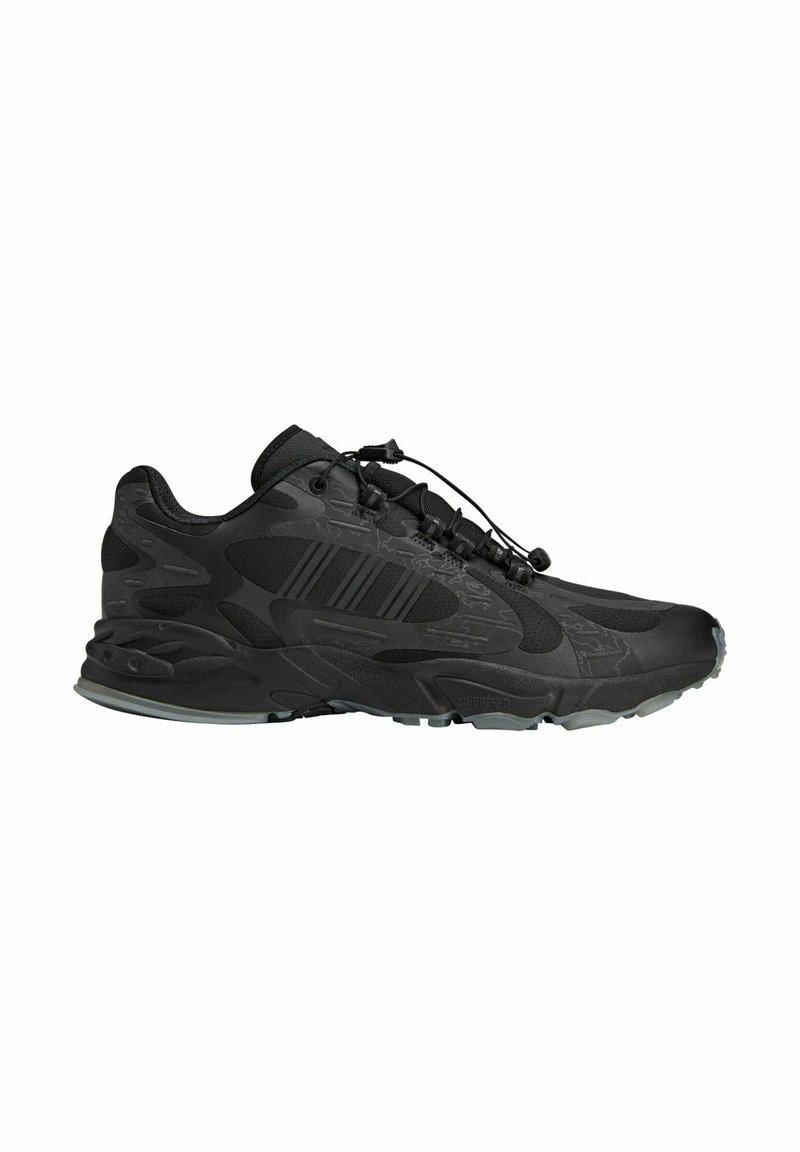 Black athletic shoe with a textured upper, integrated lacing system, and thick rubber sole. Features a dynamic design with subtle patterns.