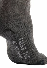 Grau gestrickte Wollsocke mit gerippter Textur, verstärktem Fersen- und Zehenbereich sowie aufgedrucktem Etikett mit der Aufschrift "PhD TN2 42-45 mm."