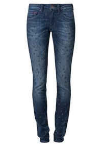 Tight jeans i mörkblå denim med en urtvättad look, med stjärnmönster i en något mörkare nyans. Klassisk femficksdesign med knäppning fram.