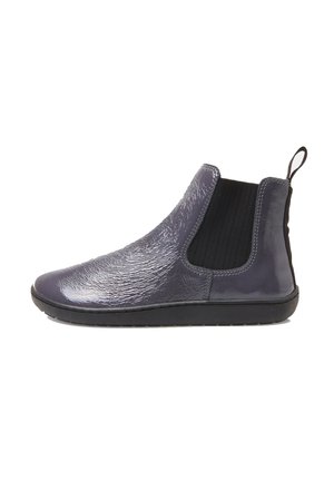 Grey chelsea boots with textured glossy upper, elastic side panels, pull tab, and black rubber sole. Minimalist design with smooth finish.