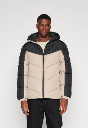 Padded jacket featuring a black and beige color block design with a hood, zip front, and elastic cuffs for adjustable fit.