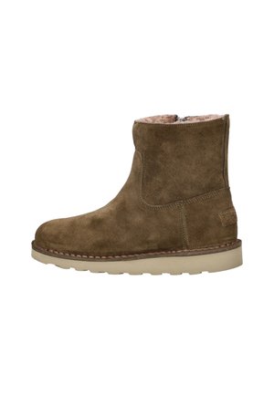 Bruine suède enkellaars met beige zool en zijrits, gevoerd met zacht lichtbruin bont voor koud weer.