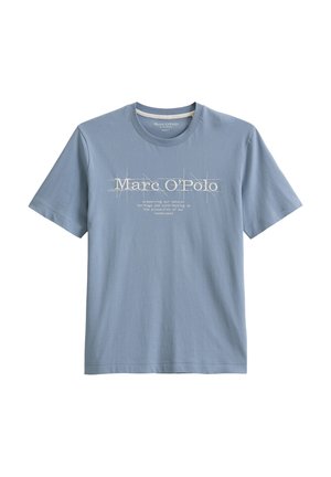 T-shirt en coton bleu clair à manches courtes et col rond. Présente du texte imprimé blanc et des éléments graphiques sur le devant.