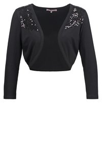Bolero corto nero a maniche lunghe con apertura frontale, decorato con paillettes nere nella zona delle spalle su entrambi i lati.
