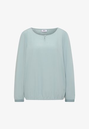 Maglietta azzurro chiaro a maniche lunghe con scollo rotondo, caratterizzata da una leggera arricciatura in vita e un dettaglio con bottone al collo. Tessuto di texture liscia.