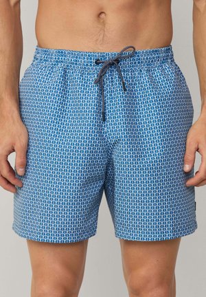 Blaue Schwimmshorts mit einem geometrischen weißen Muster, elastischem Bund mit schwarzem Kordelzug und leichtem Stoff.