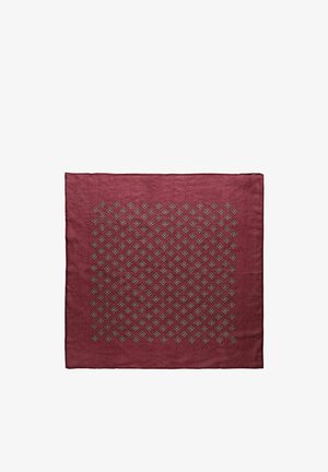 Neliömäinen kastanjanruskea kangas, jossa on tasaisesti sijoiteltu harmaiden kukka-aiheiden muodostama timantinmuotoinen kuvio keskellä.