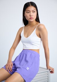adidas Originals ESSENTIALS - Spodnji deli trenirk - semi blue