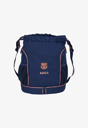 Granatowa sportowa torba ze ściągaczem, logo Barçy, boczne kieszenie z siatki, regulowany pasek na ramię i dolna komora na zamek.