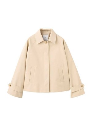 Beige cropped jacket with wide sleeves, a single visible button at the collar, two front slit pockets, and buttoned cuffs.