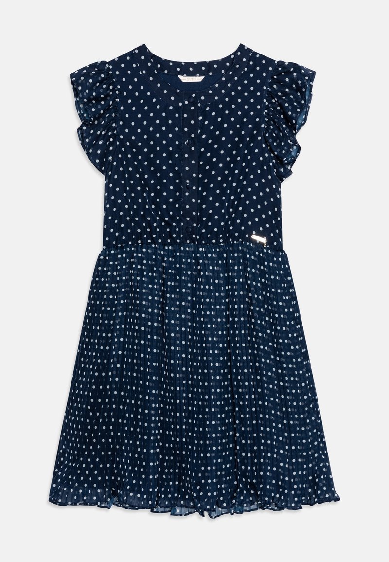 Robe bleu marine à pois blancs, avec manches courtes à volants, boutonnée devant et jupe plissée avec un léger éclat.