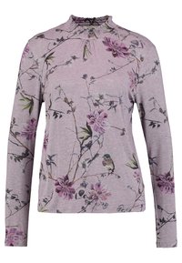 Långärmad topp i mjuk lavendelfärgad tyg, med en volangkrage och ett blommönster med fåglar. Designen innehåller gröna och rosa accenter.