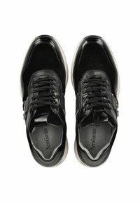 Black leather sneakers feature a combination of smooth and suede textures, lace-up design, and a contrasting white sole.