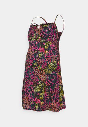 Gėlėta suknelė su reguliuojamomis n endidžių juostelių, juodu fonu, ryškiomis daugiaspalvėmis gėlėmis, surinkta iškirpte ir laisvu siluetu.