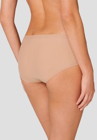 Beige, high-waisted underwear made from soft, smooth fabric. Features a seamless design with minimal coverage, suitable for everyday wear.