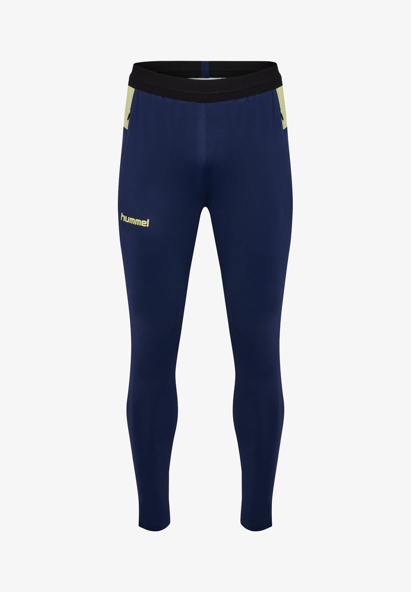 Pantalon de sport bleu marine en tissu extensible, avec une ceinture noire et des accents vert clair, arborant un logo sur la cuisse.