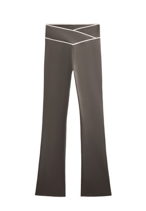 Brown flared pants with a wide waistband featuring a cross-design and white accent stitching. Smooth fabric texture, no visible pockets.