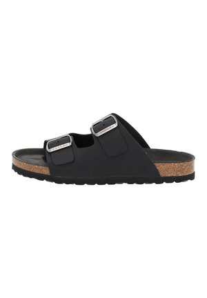 Black slide sandals with two adjustable buckles, cork footbed, and textured rubber outsole. Flat design with open toe and heel.
