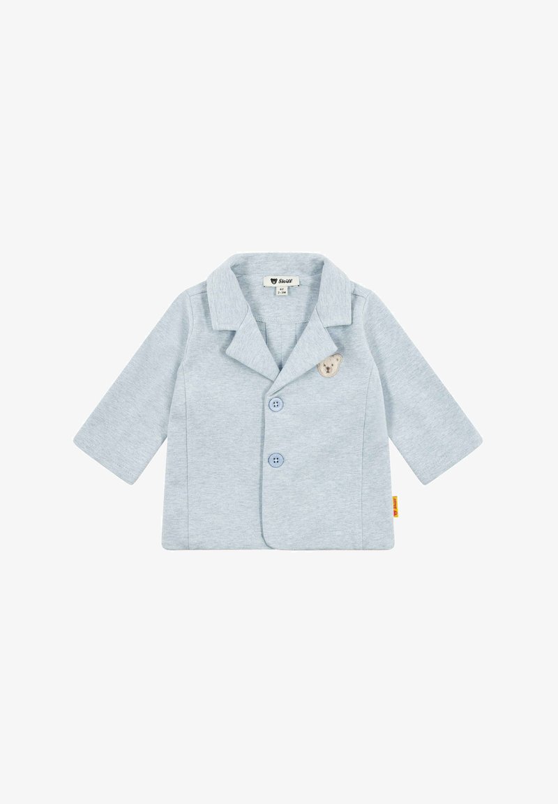 Jasnoniebieska bawełniana marynarka z wykładanym kołnierzem, dwoma guzikami z przodu oraz naszywką w kształcie misia na lewej stronie. Długie rękawy.