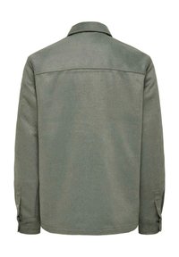 Green, textured, long-sleeve jacket with a collared neck, back yoke detail, and buttoned cuffs; designed with a straight-cut silhouette.