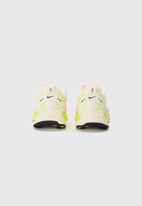 Nike running shoes featuring a lightweight off-white mesh upper with neon green accents, black sole, and pink heel detail.