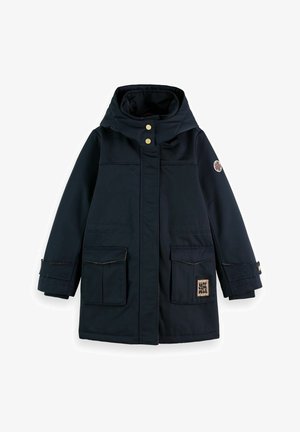 Marine Parka mit hohem Kragen, goldenen Knöpfen, zwei Fronttaschen und einem floralen Aufnäher am linken Ärmel. Glattes, wasserabweisendes Material.