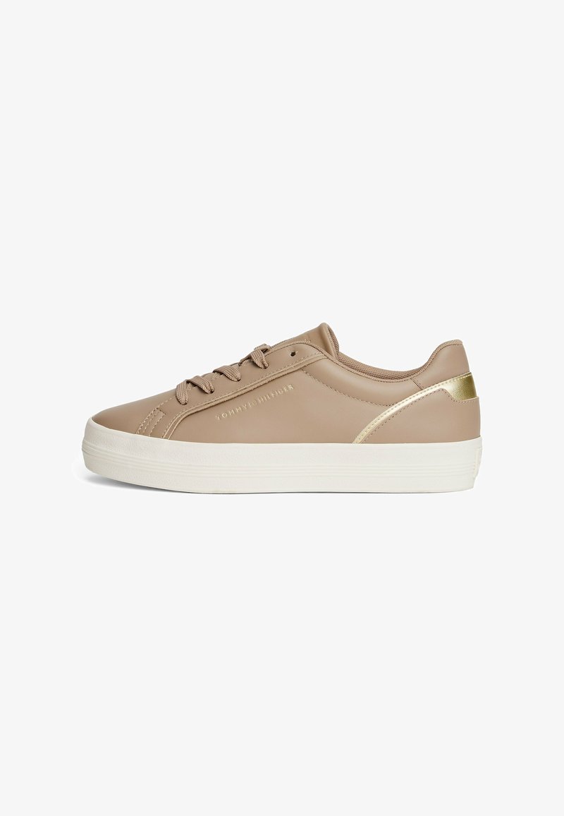 Beige synthetic sneakers with a smooth finish, white rubber sole, and gold accent on the back. Features six eyelets and rounded toe.