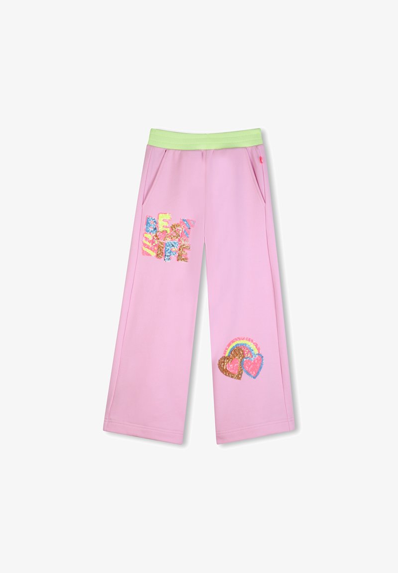 Pantaloni della tuta rosa con elastico in vita verde, dettagli con tasche, caratterizzati da testo colorato e motivi di cuori di paillettes e arcobaleni.