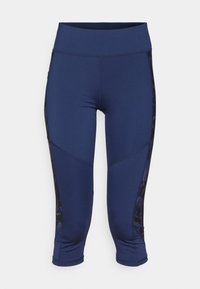 Námořnické modré sportovní capri legíny s širokým pasem, délka nad kolena a černými vzorovanými bočními panely. Vyrobené z elastického materiálu.