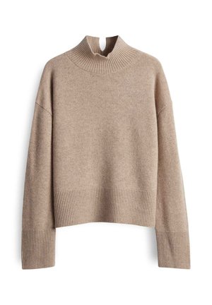 Beige gebreide trui met een hoge ribbelkraag en een cropped ontwerp. Heeft lange mouwen met ribbels aan de manchetten en een zachte textuur.