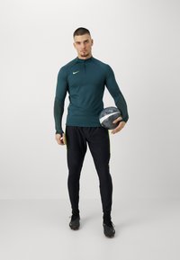Under Armour CHALLENGER PRO - Donji dijelovi trenirke - black/ high-visibility yellow