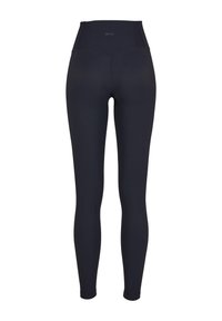 Leggings neri a vita alta con una texture a coste, dotati di una cintura liscia e di un design aderente che copre interamente le gambe.