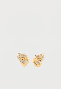 Σκουλαρίκια σε σχήμα καρδιάς από χρυσό με μια μικρότερη καρδιά στη μέση, διακοσμημένα με διάφανα στρας γύρω από την εξωτερική άκρη. Λεπτό και απαλό φινίρισμα.