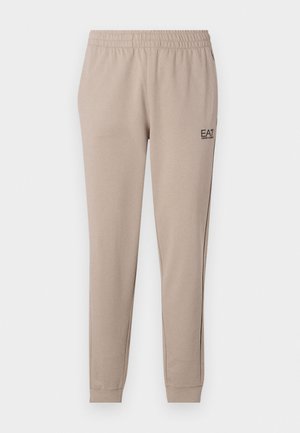Jogger beige a gamba affusolata con cintura elastica, polsini alla caviglia e un piccolo logo EA7 nero sul lato sinistro. Tessuto morbido.