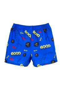 Shorts de bain bleus arborant un motif ludique de texte jaune et rouge, y compris "Paw Patrol" et "Good Pups", avec une taille élastique.