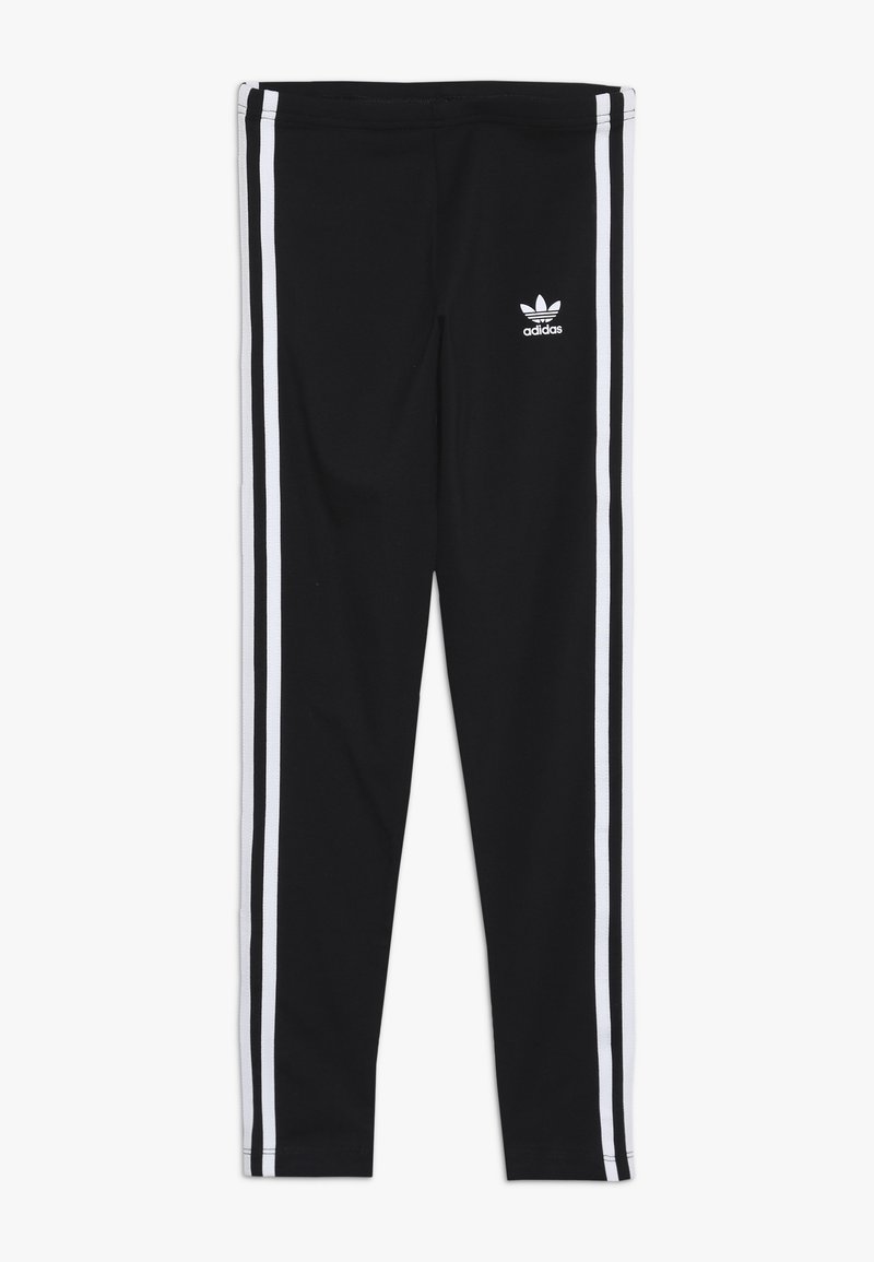 Black leggings made from stretchy fabric, featuring white side stripes and a small white logo on the left thigh. Smooth texture.