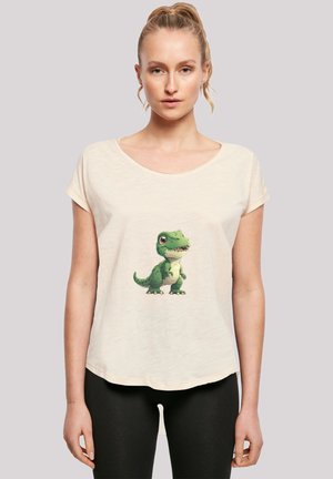 Cream-colored short-sleeve t-shirt with a round neck and a cartoon dinosaur graphic printed on the front. Soft, lightweight fabric.