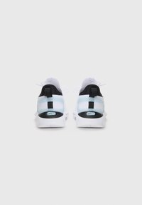 White athletic shoes with a mesh upper, black accents, and a transparent strap. Features a thick sole with "SOFTRIDE" branding on the heel.