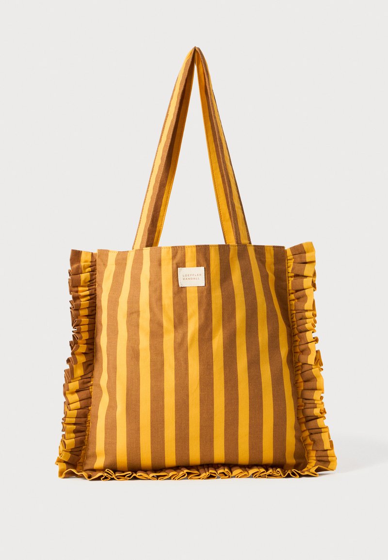 Prugasta torba u žutoj i smeđoj boji od pamuka, s nabranim rubovima, dva remena za nošenje na ramenu i malim logom na jednoj strani.