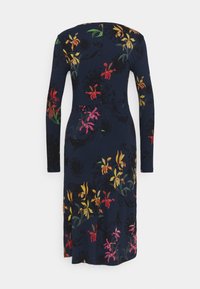 Robe côtelée marine à manches longues, avec un motif floral en rose, jaune et rouge. Ourlet légèrement évasé.