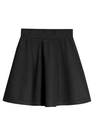 Jupe trapèze noire avec une taille haute, une silhouette évasée et une texture de tissu lisse sur fond blanc.