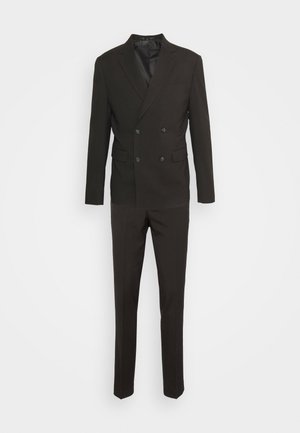 Black double-breasted suit jacket with notch lapels, paired with slim-fit trousers. Fabric appears smooth with a structured design.