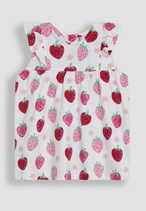 Valkoinen hihaton paita frill-roskilla, jossa on punaisia ja vaaleanpunaisia mansikkakuvioita, vihreitä lehtiä ja pieniä kukkakohtia.