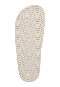 Bílá gumová podešev boty s texturovaným povrchem s horizontálními drážkami a ve středu vyraženým nápisem "PEGADOR".