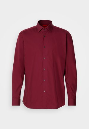 Burgundy long-sleeve shirt with a classic collar, black buttons, and a smooth fabric texture; features a structured design and tailored fit.