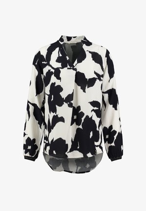 Blusa floreale in bianco e nero realizzata in tessuto leggero. Presenta un collo a V, maniche lunghe con polsini elasticizzati e orlo curvo.