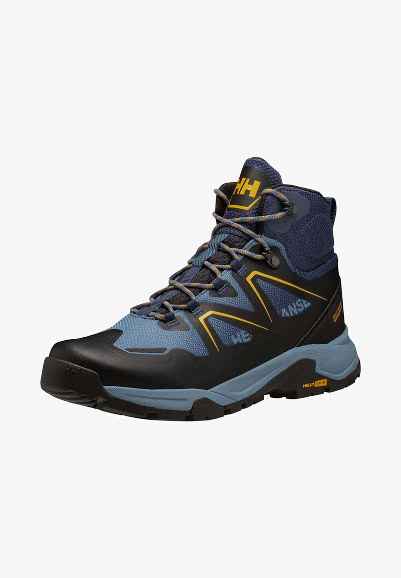 Bota de senderismo de corte medio en azul oscuro y azul claro con acentos en negro. Presenta una parte superior texturizada, sistema de cordones y una suela resistente.