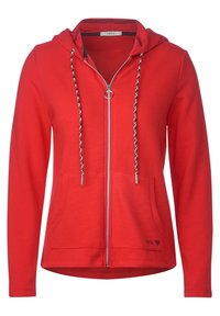 Felpa rossa con zip, in tessuto testurizzato, cappuccio, lacci intrecciati, due tasche frontali e un piccolo logo vicino all'orlo.