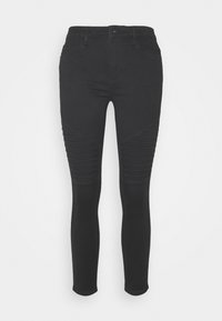 Svarta skinny jeans med en slät yta, med ribbade detaljer på övre låret och knäområdet, femfickorsdesign och bältesöglor.